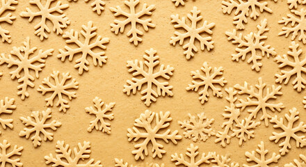 A scattering of delicate, light brown wooden snowflakes on a textured brown background