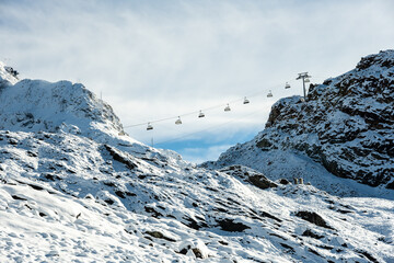 Ski LIft Climbs Hill Over First Snow Of The Year