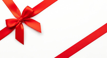 Red satin ribbon tied in a bow on a white background, gift wrapping element