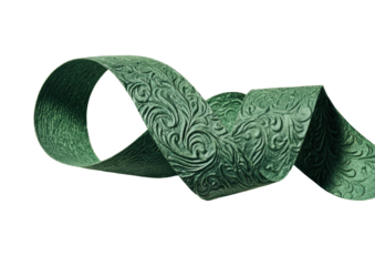 Green ribbon with floral pattern loops on a black backdrop