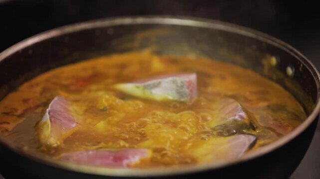 closeup shot of preparing hilsa fish curry.