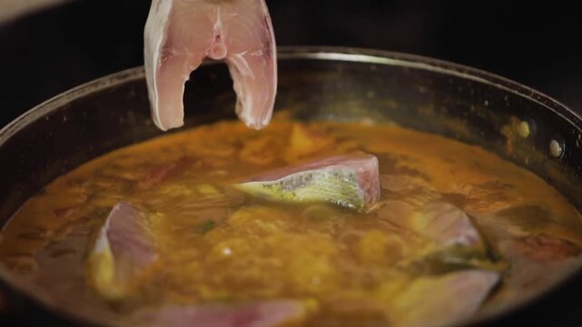 closeup shot of preparing hilsa fish curry.