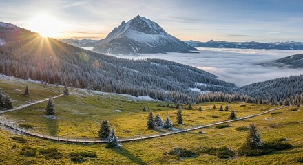 Sunrise over Snow capped Mountains, Forest, and Cloud Inversion