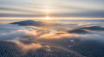 Golden Sunrise over Snowy Mountains with Foggy Valleys