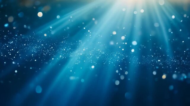 Ethereal animation of soft glowing particles gently floating and shimmering across a smooth blue gradient background with oceanic tones. Dreamy bokeh effect with varying sizes of luminous dots creatin