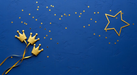 Golden crowns and star confetti on a deep blue background