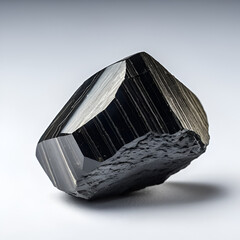 Macro of a stone Ilvaite mineral on a white background