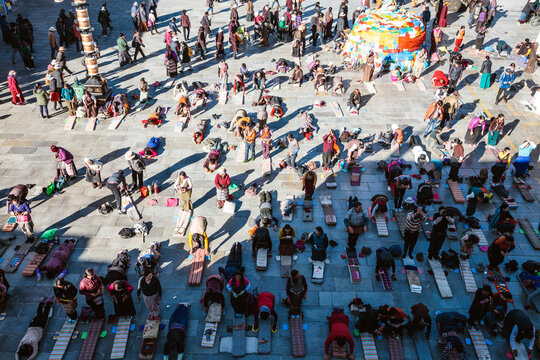 Pilgrims praying in Barkhor square, Lhasa, Tibet