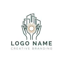A hand holding a city skyline logo