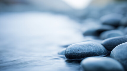 shallow. Smooth water-worn pebbles on a shallow stream bed with clear water flowing over them. travel magazines, destination branding, designed for travel destination branding.