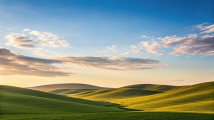 Vast green hills under a bright blue sky with fluffy clouds, creating a serene and picturesque landscape.