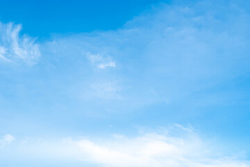 Fototapeta premium A bright, clear blue sky meets a glowing white horizon, suggesting a serene, open, and with sunlight of beautiful cloudy sky. landscape or abstract background. 