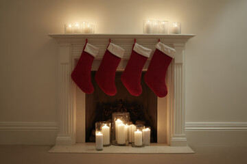 cozy american fireplace adorned with large red gift stockings emanating warmth and holiday cheer