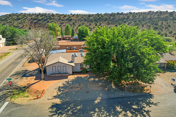 A charming house equipped with a garage and a gravel driveway