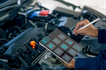 A mechanic uses a digital tablet to diagnose engine performance, monitor system data, and perform smart car maintenance. Ideal for automotive technology, vehicle diagnostics, 