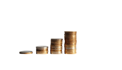 Stacks of coins arranged in ascending order on black background