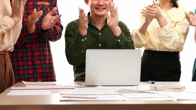 Architect and safety engineer celebrate success design building blueprint project on laptop with architectural document and measurement tool scatter around at modern office. Closeup. Delineation.