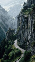 Dramatic Alpine Road Winding Through a Sheer, Fog-Shrouded Rocky Gorge.