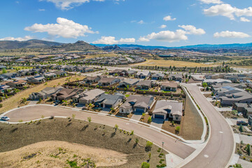 suburban aerial perspective, townscape from above showing development and natural surroundings