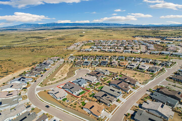 suburban aerial perspective, townscape from above showing development and natural surroundings