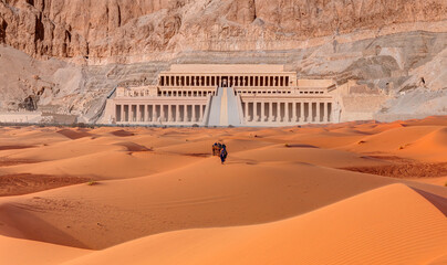 Hatshepsut Temple at sunrise in Valley of the Kings and red cliffs western bank of Nile river -...