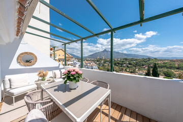 Obraz premium luxury Outdoor apartment patio with mountain view in Marbella, Spain