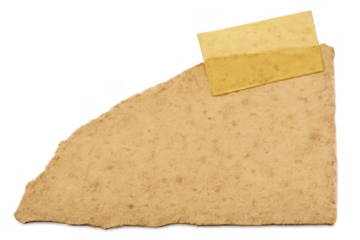 Torn old brown paper scrap with grunge texture and vintage adhesive tape on a transparent background