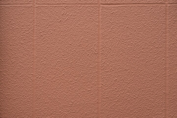 風化と経年劣化によるテクスチャ：【素材名】赤い壁に縦横の溝を少しデコボコした壁のクローズアップ