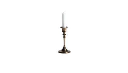 Lit white candle stands centered in a vintage brass candlestick