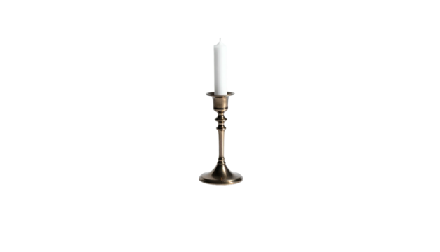 Lit white candle stands centered in a vintage brass candlestick