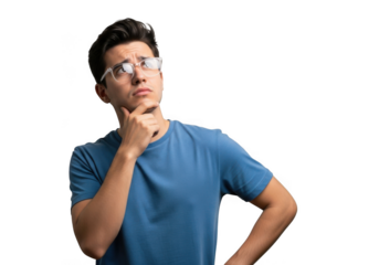 Young man wearing clear protective eyewear and a blue t shirt thinking deeply with his hand on his chin isolated on transparent background