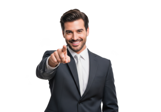 A confident smiling businessman in a dark suit and white shirt points directly forward with his index finger isolated on transparent background
