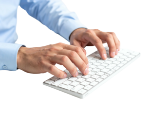 Close-up of hands typing rapidly on a white keyboard, wearing a blue long-sleeved shirt with black background