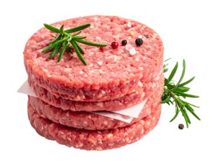 Close-up of four raw meat patties stacked on white paper, garnished with rosemary sprigs, salt, and peppercorns. A culinary delight