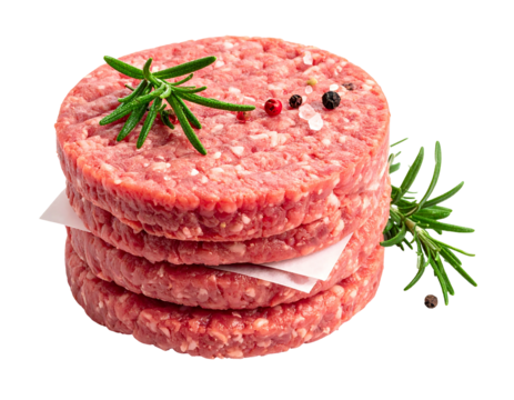Close-up of four raw meat patties stacked on white paper, garnished with rosemary sprigs, salt, and peppercorns. A culinary delight