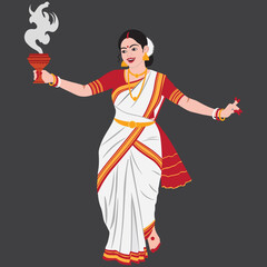 Indian woman performing traditional dance holding lit oil lamp