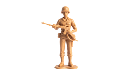Plastic toy soldier stands poised with rifle against black background