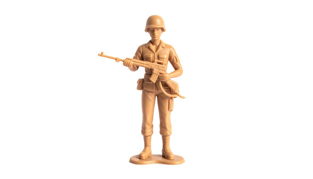 Plastic toy soldier stands poised with rifle against black background - Powered by Adobe