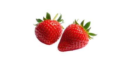 Two vibrant red strawberries with green stems on black