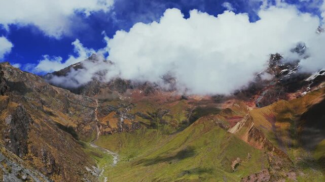 Peruvian Andes range Laguna Lake Humantay trek snow capped high altitude glacier Humantay Salkantay mountain trek Peru aerial drone rainy season sunny morning fog clouds hiking Cusco backwards motion