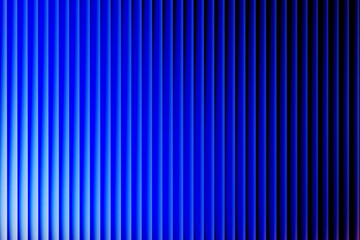 Abstract 3D panel background with vertical lines. Minimalist blue to black color gradient on a modern striped texture with light and shadow.
