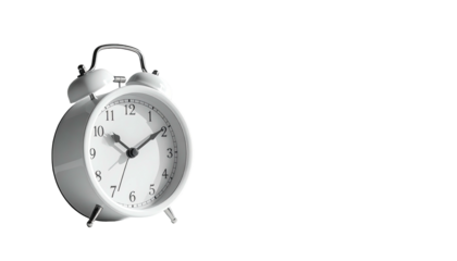 White alarm clock with bells isolated against a black backdrop
