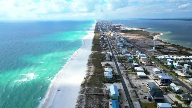 4K drone shot over Navarre Beach, Florida, captured with DJI Mini 3 Pro. Clear blue water, crisp white sand, and beachfront hotels create a bright, stunning coastal aerial scene