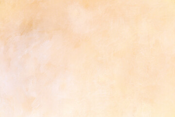 Soft textured backdrop with subtle warm light gradient gentle fading light beige to peach