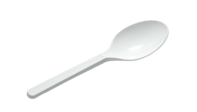 Single white plastic spoon on a dark background