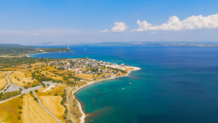 Obraz premium Seddulbahir, Eceabat, Turkey. Historic Mehmetcik Feneri lighthouse standing at entrance to Dardanelles Strait with panoramic view of Aegean Sea coastline. Aerial drone view.. Aerial View