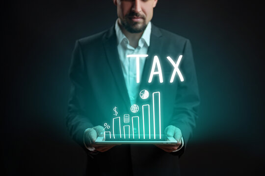 Businessman presents tax-related data on a digital tablet with growing graphs