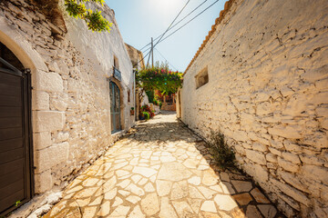 Alley decorated with flowers in the picturesque village of Afionas vacation on the island of Corfu in Greece near
Porto Timoni beach