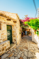 Alley decorated with flowers in the picturesque village of Afionas vacation on the island of Corfu in Greece nearPorto Timoni beach