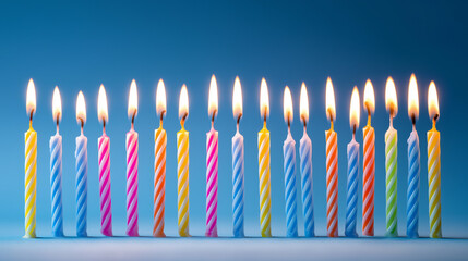 blow. Colorful birthday candles with glowing flames, arranged neatly on a blue surface. symbolizing life milestones and joyful moments.